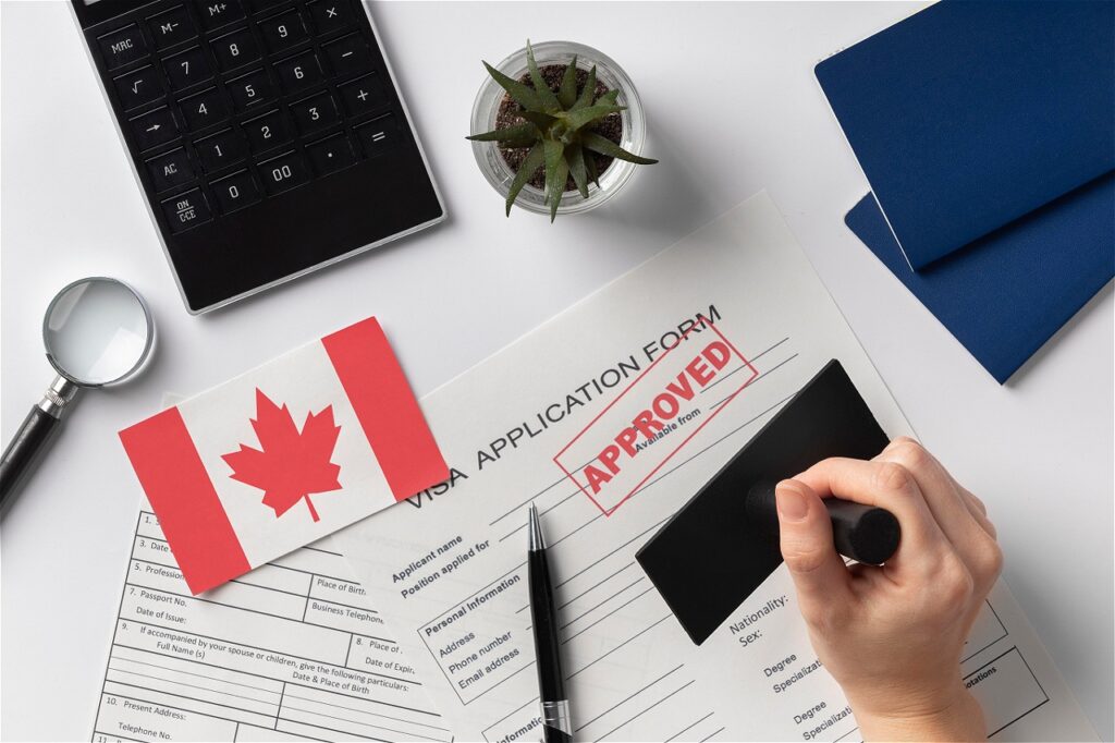 Approved visa application form with a Canadian flag